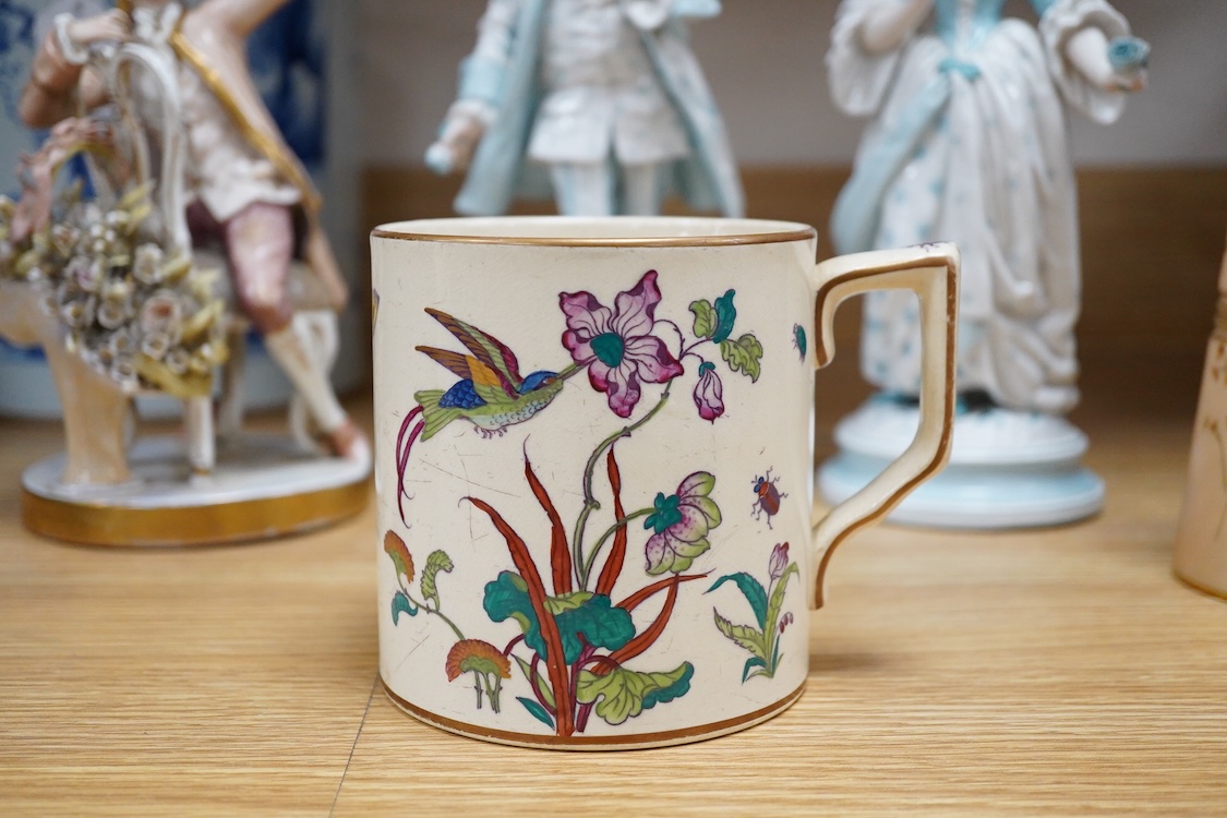 Sundry porcelain comprising three German figures, a Royal Worcester blush ivory ewer and a mug, together with a blue wine glass, largest 26cm high
